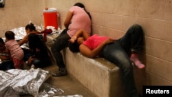 Immigrants who have been caught crossing the border illegally are housed inside the McAllen Border Patrol Station in McAllen,Texas, July 15, 2014, where they are processed.