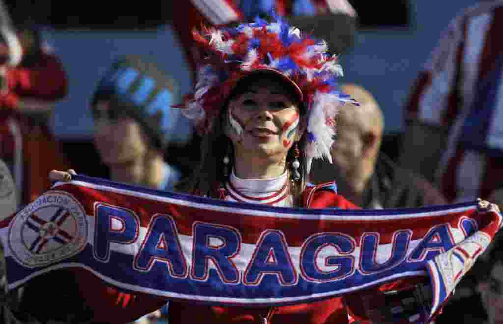 A Paraguayan fan poses for pictures before the Copa America final soccer match between Uruguay and Paraguay in Buenos Aires, Argentina, Sunday, July 24, 2011. Uruguay is trying to become the tournament's most successful team, while Paraguay is looking to