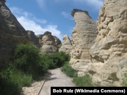 Carvings are seen in rock structures called hoodoos in Writing-on-Stone Provincial Park, Alberta, Canada.