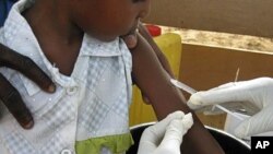 A child receives a vaccination on the opening day of a meningitis vaccination campaign in Niger, 04 Apr. 2010