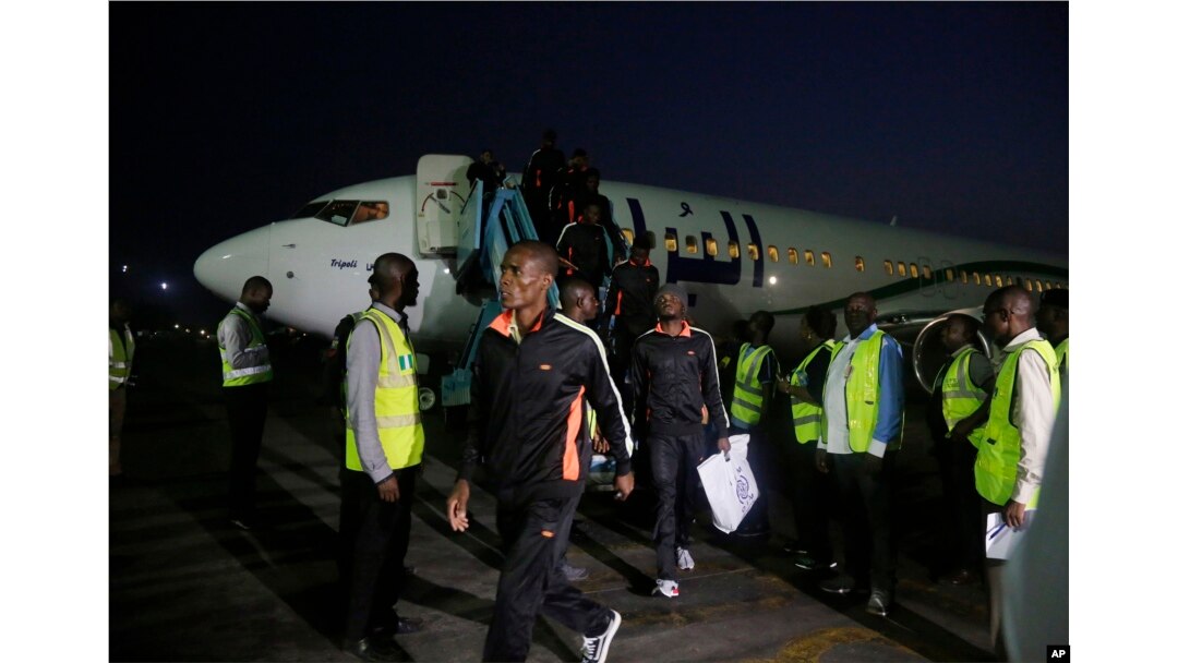 Nigerian returnees from Libya disembark from a plane upon arrival at the Murtala Muhammed International Airport in Lagos, Nigeria, Dec. 5, 2017.
