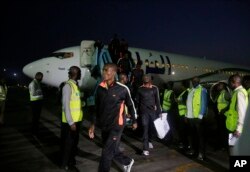 Nigerian returnees from Libya disembark from a plane upon arrival at the Murtala Muhammed International Airport in Lagos, Nigeria, Dec. 5, 2017.