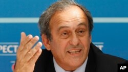 FILE - UEFA President Michel Platini (now suspended) delivers his speech during a press conference after the soccer Europa League draw ceremony at the Grimaldi Forum, in Monaco, Aug. 28, 2015.
