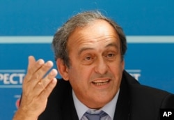 FILE - UEFA President Michel Platini delivers his speech during a press conference after the soccer Europa League draw ceremony at the Grimaldi Forum, in Monaco, Aug. 28, 2015.