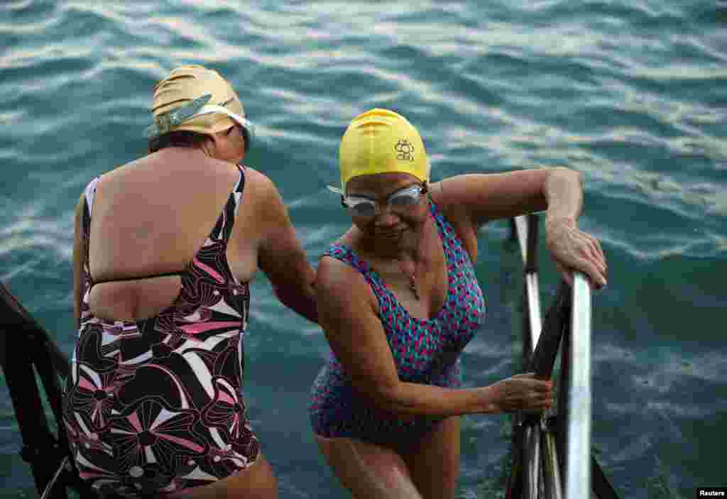 Women prepare to swim in the sea at the Sai Wan Swimming Shed in Hong Kong, China, October 4, 2018. REUTERS/Hannah