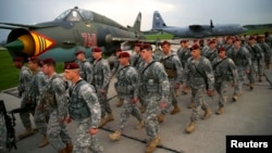 First company-sized contingent of about 150 U.S. paratroopers from the U.S. Army's 173rd Infantry Brigade Combat Team based in Italy march as they arrive to participate in training exercises with the Polish army in Swidwin, Poland, April 23, 2014.