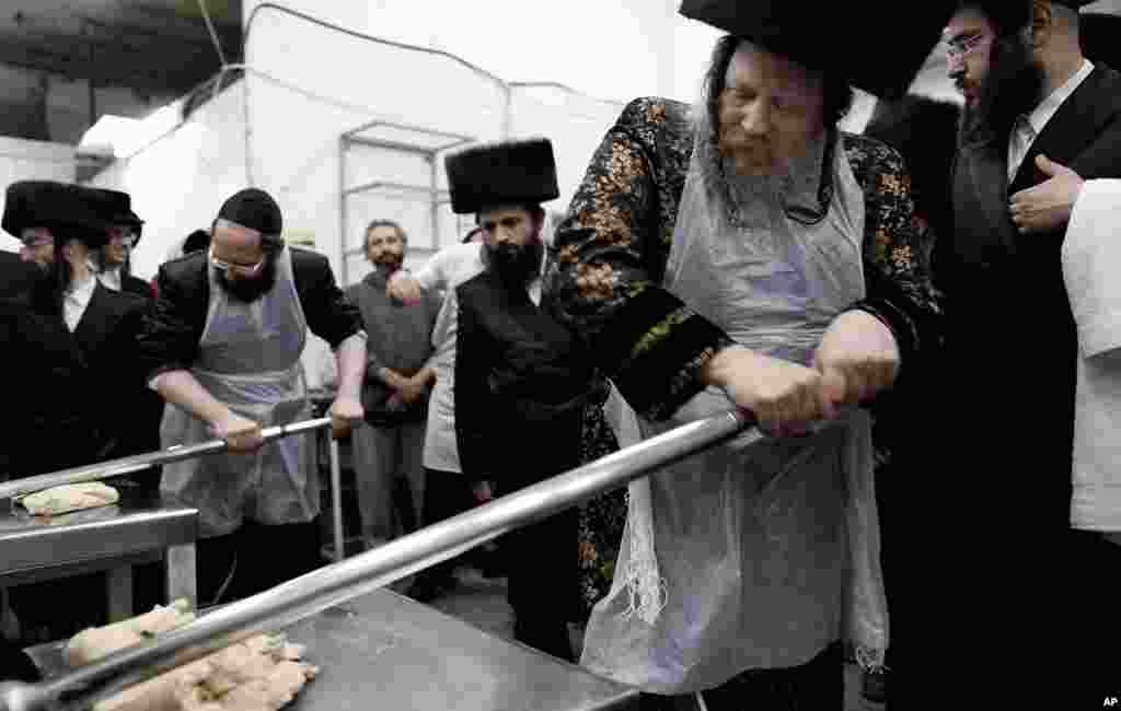 Orthodox Jews prepare special matzoh at a bakery before the Passover holiday in the port city of Ashdod, Israel. (AP)
