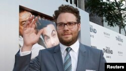 Director, writer and cast member Seth Rogen waves at the premiere of "This Is the End" at the Regency Village Theatre in Los Angeles, California June 3, 2013. The movie opens in the U.S. on June 12. REUTERS/Mario Anzuoni (UNITED STATES - Tags: ENTERTAIN