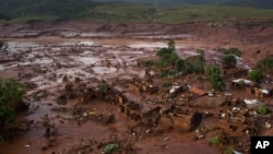 Aerial view of the debris after a dam burst at the small town of Bento Rodrigues in Minas Gerais state, Brazil, Nov. 6, 2015. 