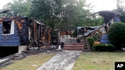 The house owned by Lawrence Police Officer Ivan Soto sits nearly burned to the ground on Jefferson Street, in Lawrence, Mass., Sept. 14, 2018. It was one of multiple houses that went up in flames Thursday afternoon after gas explosions and fires triggered by a problem with a gas line.