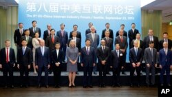 Chinese President Xi Jinping, front-row-center, poses for a photo with a group of CEOs and other executives at Microsoft's main campus in Redmond, Wash., Wednesday, Sept. 23, 2015. (AP Photo/Ted S. Warren, Pool)