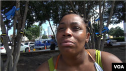 Leonesea Morgan, who is paying her respects to the fallen officers, is also angered by police shootings in Dallas, Texas, July 12, 2016. (M. O'Sullivan/VOA)