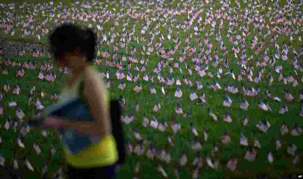 Some 2,977 American flags representing each person killed in the September 11, 2001 attacks decorate a lawn on the campus of Georgia Tech Institute of Technology, Atlanta, Georgia, September 11, 2012.