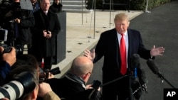 President Donald Trump berbicara kepada para wartawan di South Lawn di Gedung Putih, Washington, 29 November 2018.