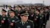 中国军队拟三年内全面停止有偿服务