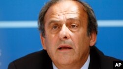 FILE - UEFA President Michel Platini delivers his speech during a press conference after the soccer Europa League draw ceremony at the Grimaldi Forum, in Monaco, August 28, 2015.