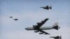 A U.S. Air Force B-52 bomber flies over Osan Air Base in Pyeongtaek, South Korea, Jan. 10, 2016. The bomber flew low over South Korea on Sunday, a show of force from the U.S. as a Cold War-style standoff deepened between ally Seoul and North Korea.