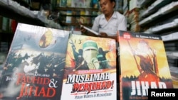 FILE - A vendor displays books written about jihad in an Islamic book store in Jakarta.