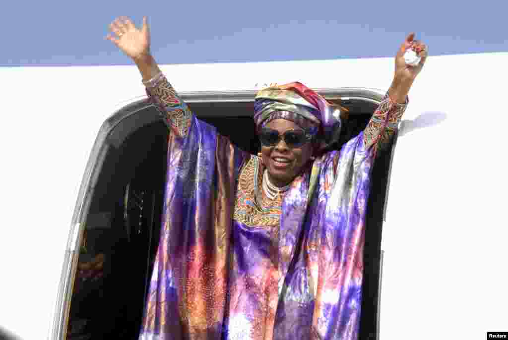 First Lady Patience Jonathan waves after arriving in Abuja from Germany after treatment for an undisclosed illness, October 2012.
