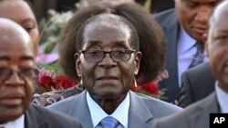 FILE: Zimbabwean president, Robert Mugabe, center, arrives in Pretoria, South Africa Tuesday, April 7, 2015 for a state visit to the country. (AP Photo)