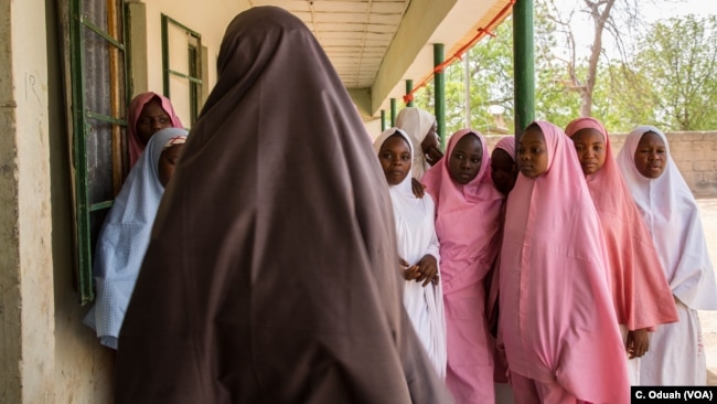 Students from Dapchi girls school return to school for the first day after Boko Haram invaded the campus in February, abducting more than 100 students.