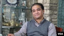 资料照片：维吾尔族学者伊力哈木·土赫提2013年接受美国之音采访。