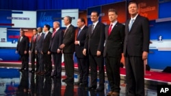 FILE - Republican presidential candidates from left, Chris Christie, Marco Rubio, Ben Carson, Scott Walker, Donald Trump, Jeb Bush, Mike Huckabee, Ted Cruz, Rand Paul, and John Kasich, Quicken Loans Arena, Cleveland, Ohio.