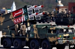 A Nasr missile is loaded on vehicle during the Pakistan National Day parade in Islamabad, Pakistan, March 23, 2015.
