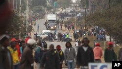 FILE: Rioters clash with Zimbabwean police in Harare, Monday, July, 4, 2016. (AP Photo/Tsvangirayi Mukwazhi)
