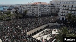 People gather during a protest over President Abdelaziz Bouteflika's decision to postpone elections and extend his fourth term in office, in Algiers, Algeria March 15, 2019.