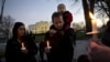 Supporters of gun control gather on Pennsylvania Avenue in front of the White House in Washington, Friday, Dec. 14, 2012, during a vigil for the victims of the shooting at Sandy Hook Elementary School in Newtown, Ct., and to call on President Obama to pas
