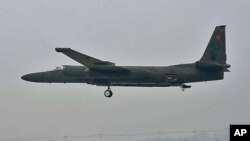 A U-2 flies at low altitude on an overcast Korean morning, Osan Air Base, South Korea, December 2011.