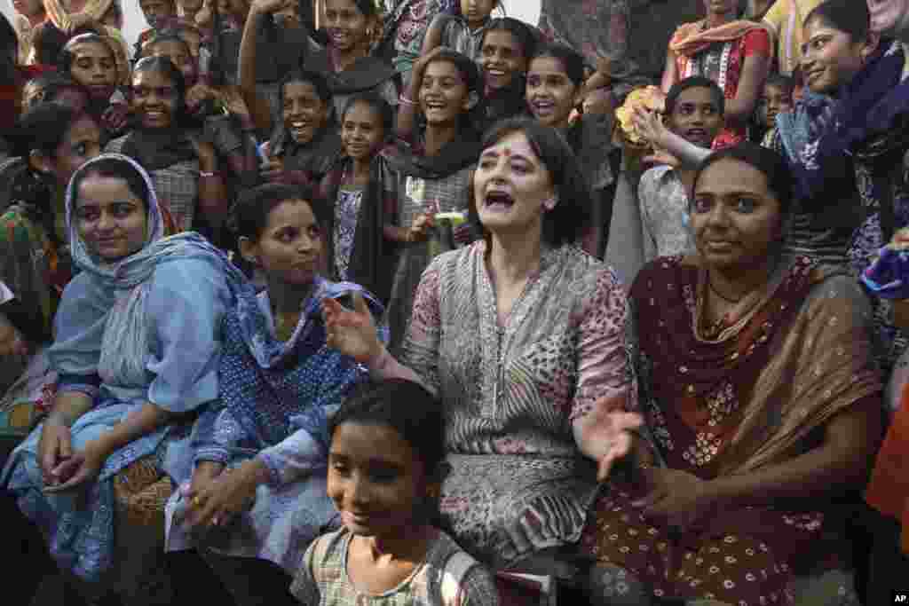 Cherie Blair, center, wife of former British Prime Minister Tony Blair gestures during her visit to the Rural Distribution Network India (RUDI) center at Kuda village in Surendranagar district, Gujarat, India.