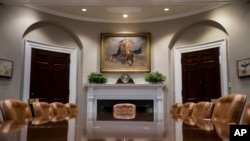 A portrait of Teddy Roosevelt "The Rough Rider" by Tadé (Thadeus) Styka is seen in the newly renovated Roosevelt Room of the White House in Washington, Aug. 22, 2017, during a media tour.