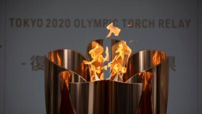 Ngọn đuốc Olympic Tokyo tại một buổi lễ cử hành tại tp. Fukushima, Nhật Bản, thứ Ba 24/3/2020,
(AP Photo/Jae C. Hong)
