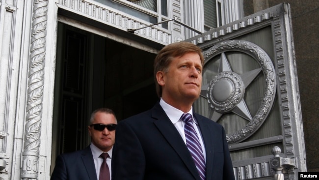 FILE - U.S. Ambassador Michael McFaul walks outside as he leaves the Russian Foreign Ministry headquarters in Moscow, May 15, 2013.