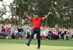 FILE - Tiger Woods celebrates on the 18th hole to win the 2019 Masters. (REUTERS/Lucy Nicholson/File Photo)