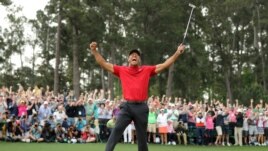 FILE - Tiger Woods celebrates on the 18th hole to win the 2019 Masters. (REUTERS/Lucy Nicholson/File Photo)