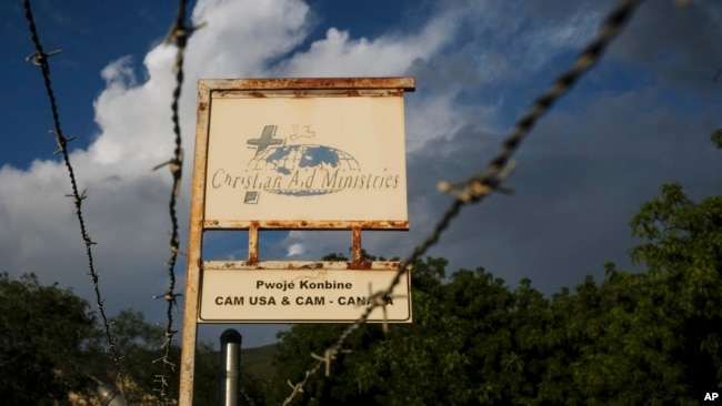 This Oct. 21, 2021, photo shows a sign outside Christian Aid Ministries in Titanyen, Haiti. (AP Photo/Matias Delacroix, File)