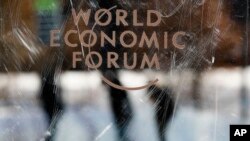 The logo of the World Economy Forum is displayed on a door at the Congress Centre in Davos, Switzerland, Sunday, Jan. 19, 2020. 
