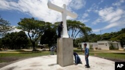 Workers touch up the Cross of the Reconciliation in preparation for the upcoming papal visit, at Parque de Fundadores or Founders Park, in Villavicencio, Colombia, Aug. 30, 2017.