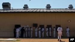 FILE - Prisoners stand in a crowded lunch line during a prison tour at Elmore Correctional Facility in Elmore, Alabama, June 18, 2015.