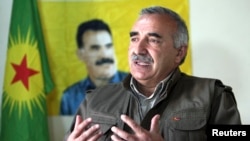 Murat Karayilan, acting military commander of the Kurdistan Workers Party (PKK), speaks during an interview with Reuters at the Qandil mountains near the Iraq-Turkish border in Sulaimaniya, 330 km (205 miles) northeast of Baghdad, Mar. 24, 2013. 