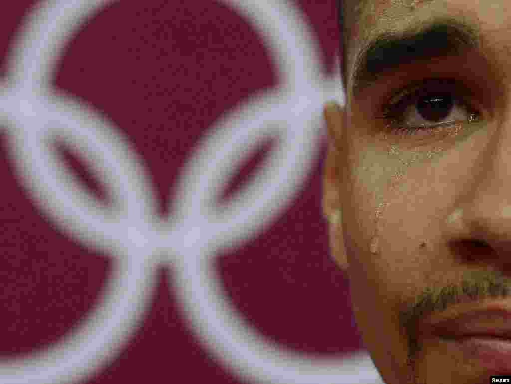 Louis Smith of Great Britain cries during the men's gymnastics qualification in the North Greenwich Arena during the London 2012 Olympic Games July 28, 2012. 
