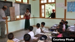 Students at the Nan Ouw School in Burma recite the Burmese and English alphabet for "Build a School in Burma" founder Bob Cornwell. (Courtesy Build a School in Burma)