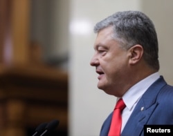 FILE - Ukraine's President Petro Poroshenko delivers his annual address to parliament in Kyiv, Sept. 20, 2018.