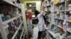 FILE - A pharmacist arranges medicine on shelves at a pharmacy in central Tehran, Iran, Dec. 11, 2012.