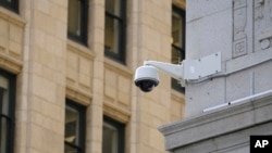 In this photo taken Tuesday, May 7, 2019, is a security camera in the Financial District of San Francisco. (AP Photo/Eric Risberg)