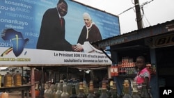 Billboard announces Papal visit to Benin's largest city, Cotonou, Nov. 16, 2011.