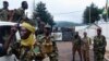 Fighters for the Seleka rebel alliance stand guard in front of the presidential palace in Bangui, Central African Republic, March 25, 2013.